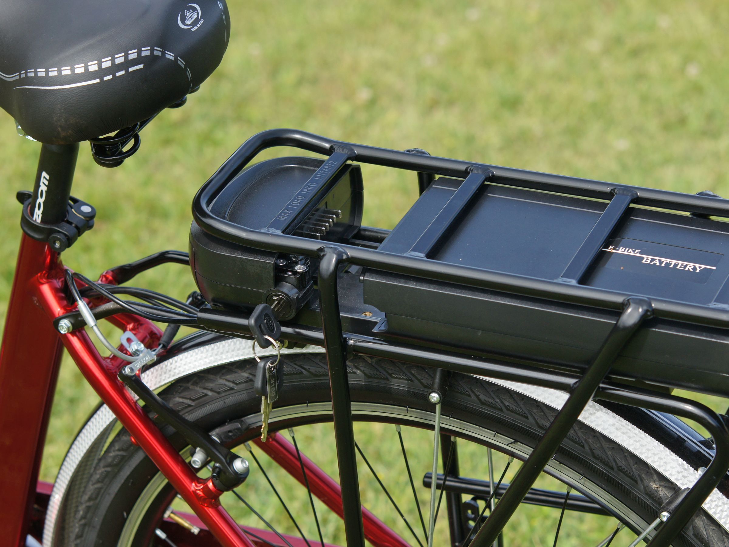 Close-up of an e-bike battery mounted on a rear rack